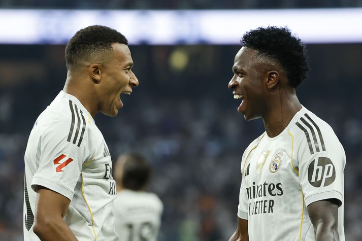  Kylian Mbappe og Vinicius Junior fagna sigurmarki þess fyrrnefnda í kvöld.