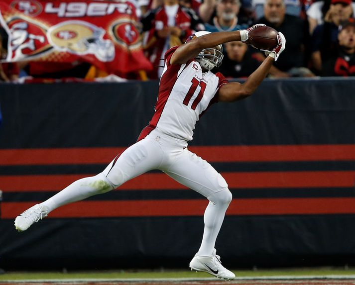 Larry Fitzgerald, útherji Arizona, skorar hér annað tveggja snertimarka sinna í gær.