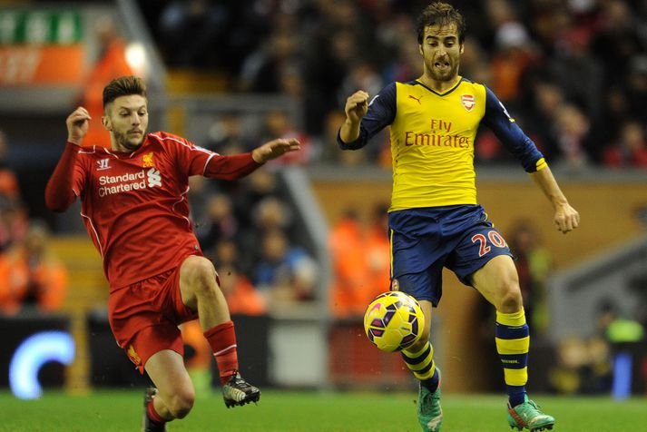 Mathieu Flamini og Adam Lallana í leiknum.