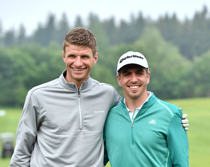 Liðsfélagarnir Thomas Müller og Philipp Lahm taka því rólega á golfvellinum í sumarfríinu sínu.