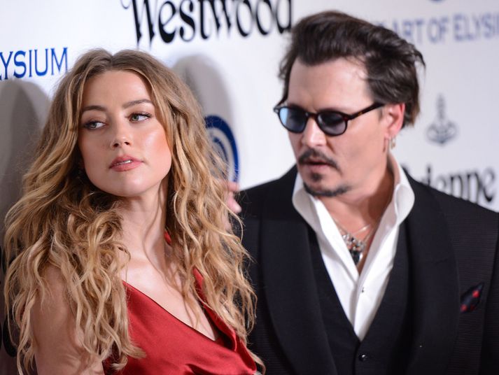 Amber Heard hefur sakað eiginmann sinn um ofbeldi.