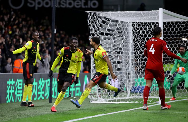Watford fagna einu marka sinna í gær á meðan Van Dijk og Alisson skilja hvorki upp né niður.