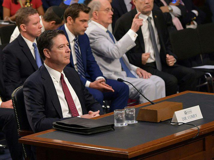 James Comey í sæti sínu í dag.