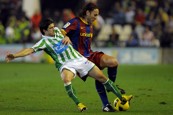 Milito í leik með Barcelona á síðustu leiktíð.