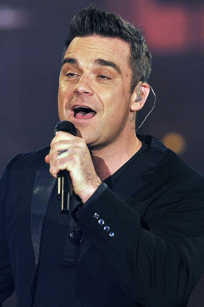 syngur fyrir pabba Robbie Williams ætlar að syngja í brúðkaupi föður síns.nordicphotos/getty