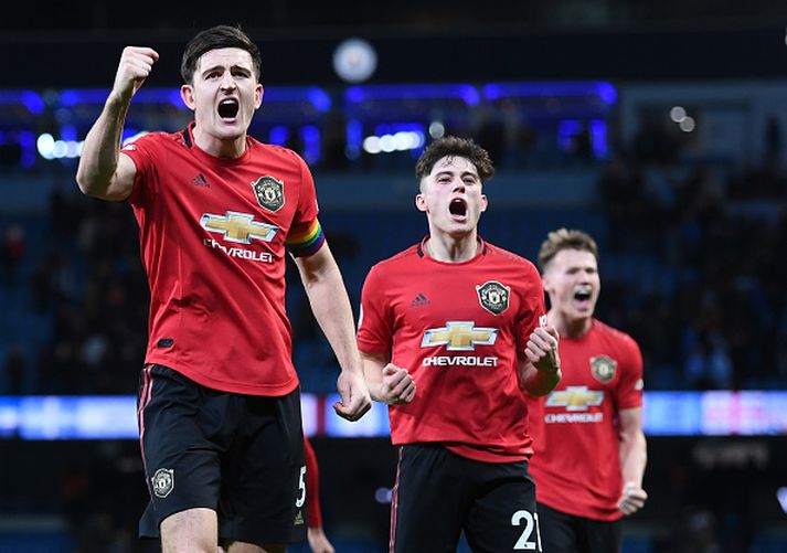 Harry Maguire, Daniel James og Scott McTominay fagna í leikslok.