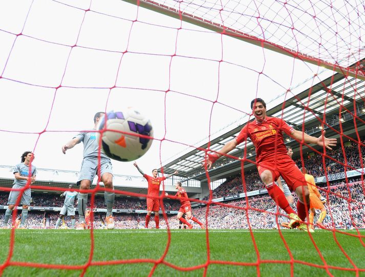 Luis Suarez fagnar marki með Liverpool þar sem hann spilaði á árunum 2010 til 2014 og varð að heimsklassa framherja.