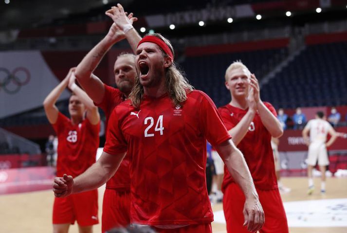 Mikkel Hansen fagnar sigri með danska landsliðinu.