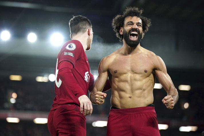 Mohamed Salah fagnar sjötta marki Liverpool og öðru marki sínu í leiknum á Anfield í gær.