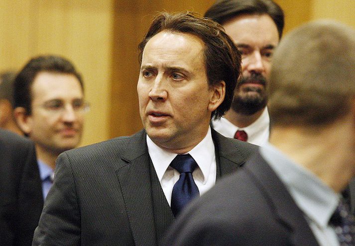 Cage er grunaður um að hafa beitt konuna sína ofbeldi. Mynd/ afp.