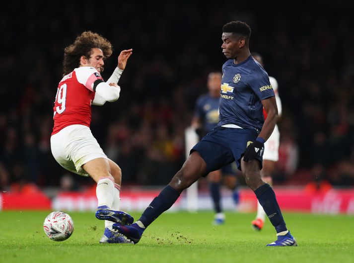 Guendouzi og Pogba í baráttunni.