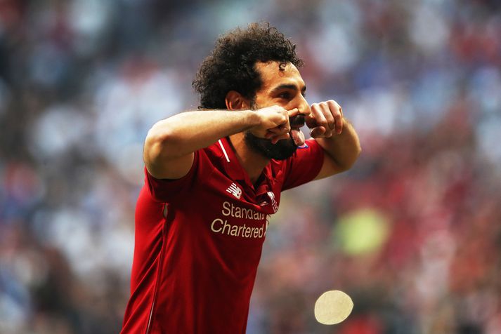 Mohamed Salah fagnar marki með Liverpool.