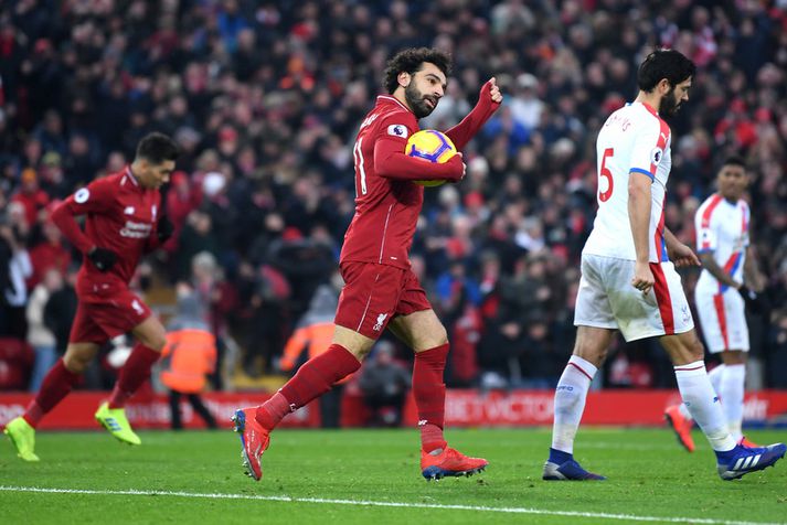 Mohamed Salah fagnar marki með Liverpool.