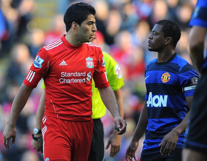munu þeir haga sér vel? Augu margra verða á Evra og Suarez í leiknum á morgun.nordicphotos/getty