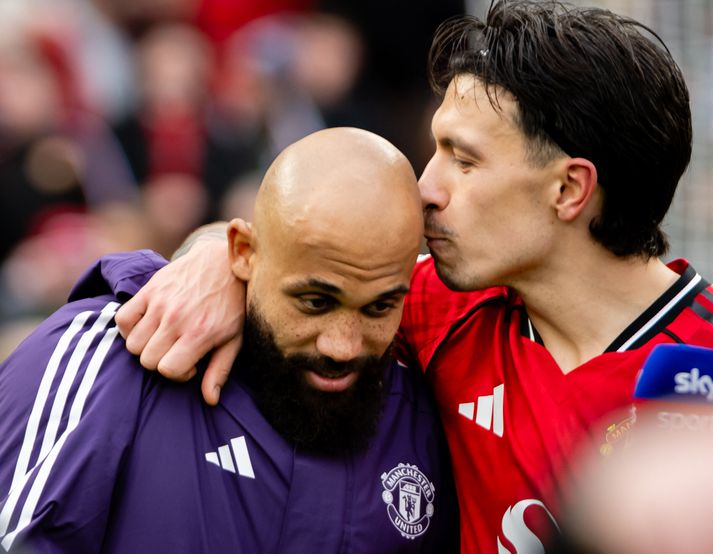 Lisandro Martínez smellir kossi á kollinn á Bryan Mbeumo.