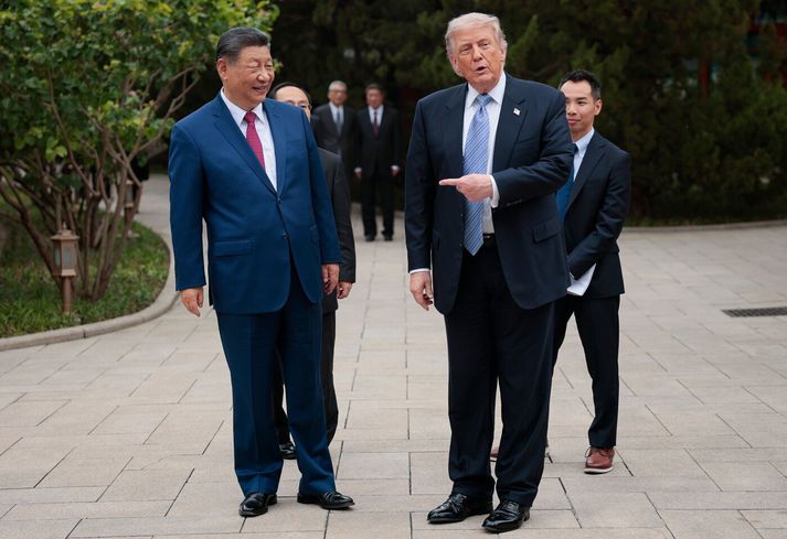 Xi Jinping og Donald Trump í Kína í morgun.