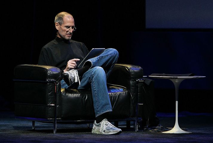 Apple Announces Launch Of New Tablet Computer SAN FRANCISCO - JANUARY 27:  Apple Inc. CEO Steve Jobs demonstrates the new iPad as he speaks during an Apple Special Event at Yerba Buena Center for the Arts January 27, 2010 in San Francisco, California. Apple introduced its latest creation, the iPad, a mobile tablet browsing device that is a cross between the iPhone and a MacBook laptop.  (Photo by Justin Sullivan/Getty Images)