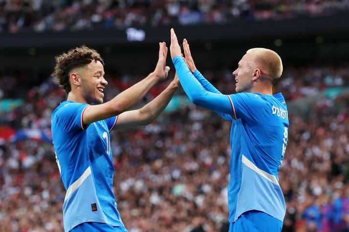 England v Iceland - International Friendly LONDON, ENGLAND - JUNE 07: Jon Dagur Thorsteinsson of Iceland celebrates scoring his team's first goal with teammate Mikael Anderson during the international friendly match between England and Iceland at Wembley Stadium on June 07, 2024 in London, England. (Photo by Richard Pelham/Getty Images)