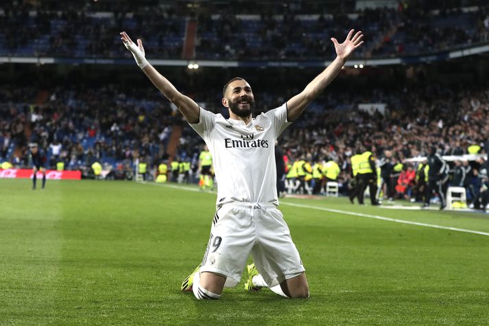 Bjargvætturinn Benzema fagnar sigurmarkinu gegn Huesca.