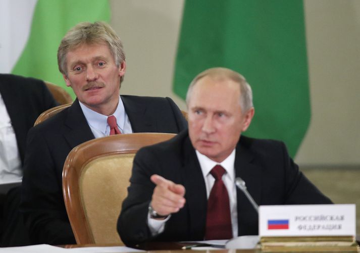 Dmitry Peskov og Vladimir Pútín.