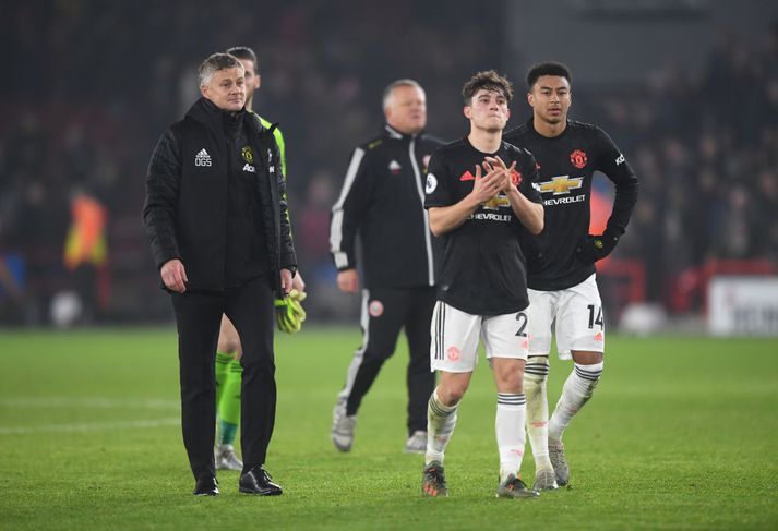 Jesse Lingard, Daniel James og Ole Gunnar Solskjær niðurlútnir í leikslok.