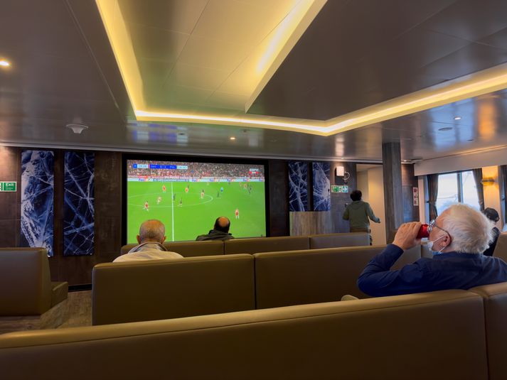 Hantavirus Ship Passengers on the hantavirus-stricken cruise ship, MV Hondius, watch a football match on a television during their voyage to Spain's port of Tenerife, May 6, 2026. (AP Photo)