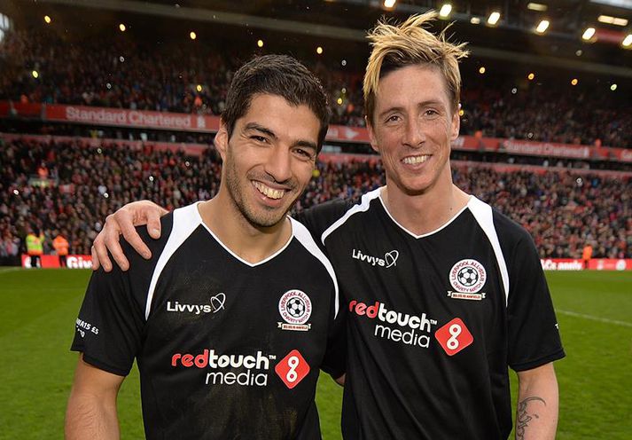 Suarez og Torres kátir eftir leik í gær.