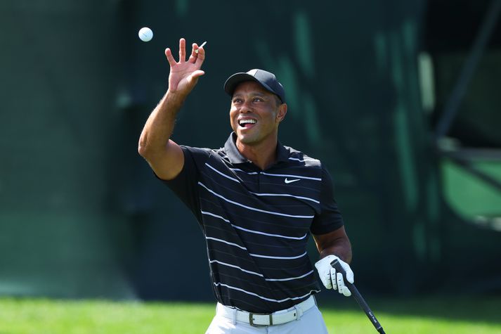 Létt var yfir Tiger Woods þegar hann æfði á Augusta National vellinum í gær.