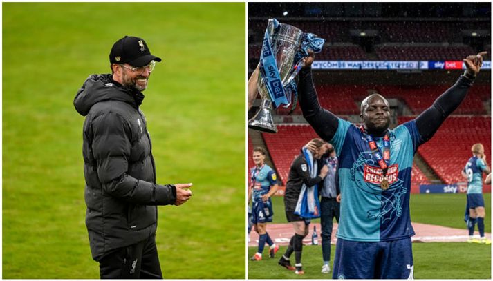 Klopp og Akinfenwa, báðir á góðri stundu en þeir fara sáttir inn í sumarfrí. Klopp sem enskur meistari og Akinfenwa með Wycombe upp í ensku B-deildina.