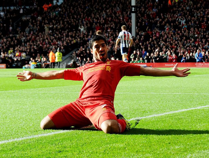 Suarez fagnar í dag.