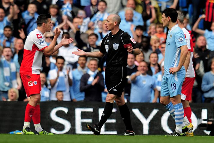 Joey Barton fékk tólf leikja bann fyrir hegðun sína í lokaleik tímabilsins gegn Man. City.