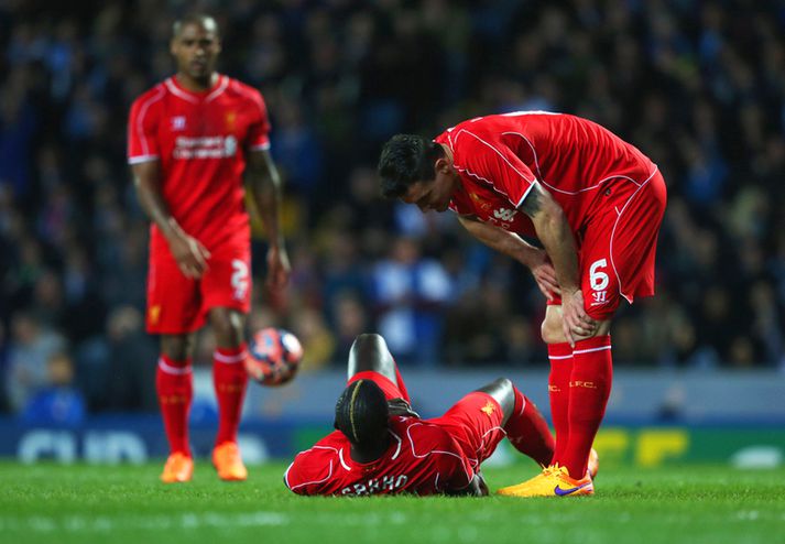 Sakho liggur í grasinu í leiknum gegn Blackburn.