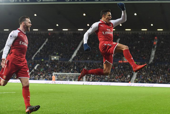 Alexis Sanchez fagnar hér marki með Arsenal.
