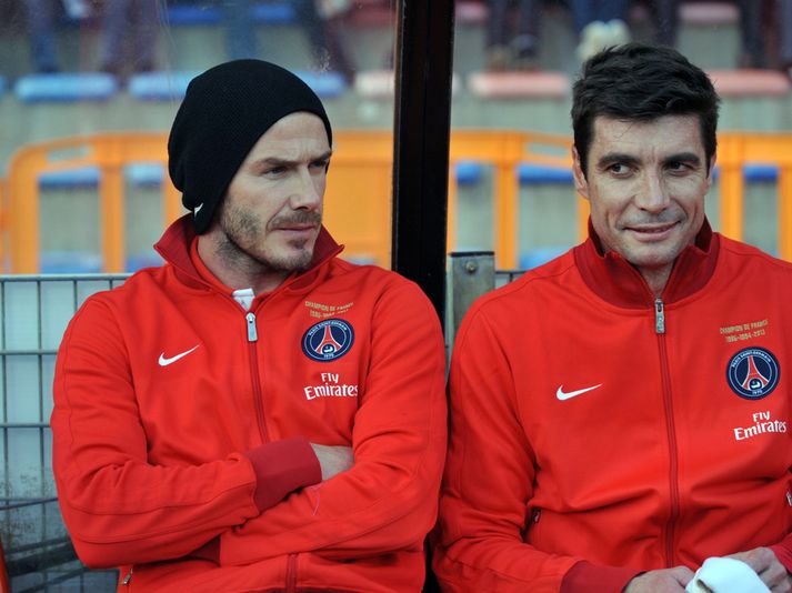 Le Crom við hlið Beckham á bekknum.