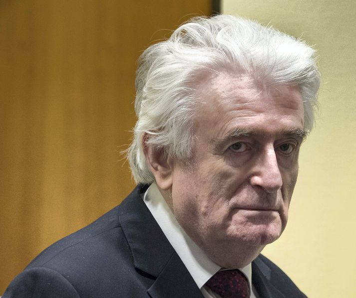 Karadzic er sagður ekki hafa sýnt svipbrigði þegar dómurinn var kveðinn upp í Haag í dag.