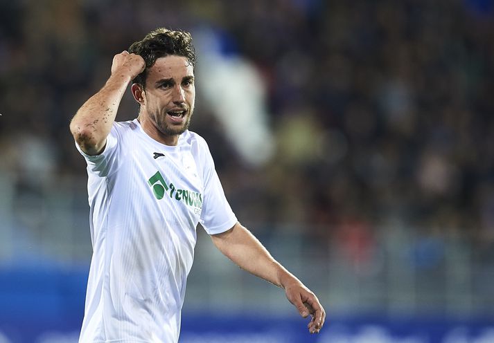 Jaime Mata skoraði bæði mörk Getafe gegn Huesca.