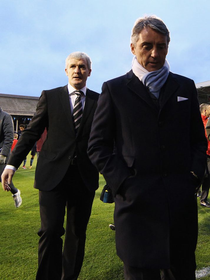 Roberto Mancini og Mark Hughes ganga til leiks í dag.