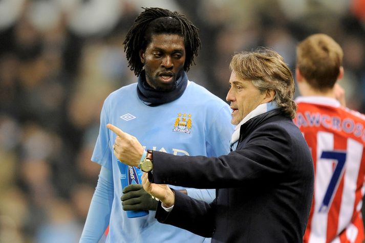 Adebayor og Mancini ræðast hér við í leik á síðustu leiktíð.