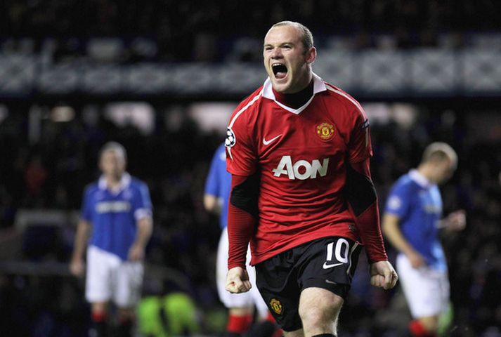 Wayne Rooney fagnar markinu í gær.