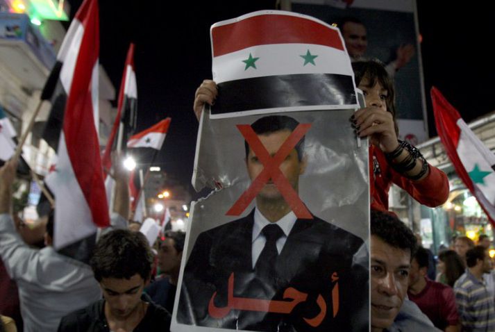Stjórn Bashar al-Assad mótmælt í myndum.