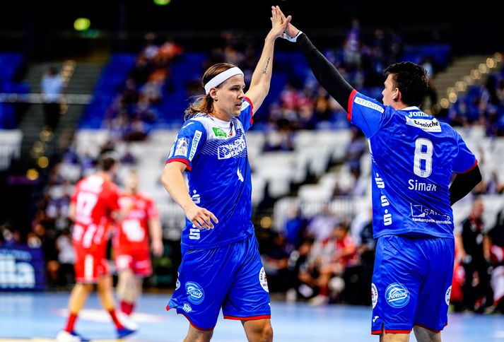 TBV Lemgo Lippe - MT Melsungen 04 June 2021, Hamburg: Handball: DHB Cup, TBV Lemgo Lippe - MT Melsungen, Main Round, Final Four, Final. Lemgo's Bjarki Mar Elísson (l) and Lemgo's Frederik Simak celebrate a goal. Photo: Axel Heimken/dpa (Photo by Axel Heimken/picture alliance via Getty Images)