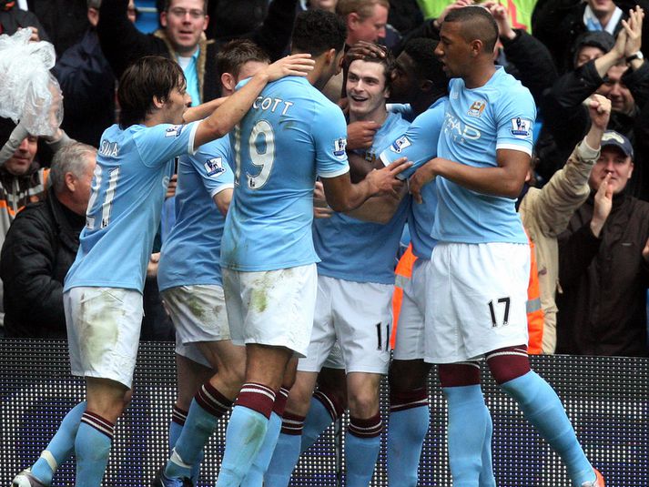 Leikmenn Manchester City fagna sigurmarki sínu um síðustu helgi.