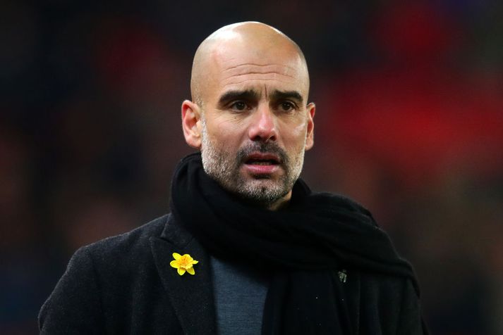 Guardiola með borðann umdeilda.