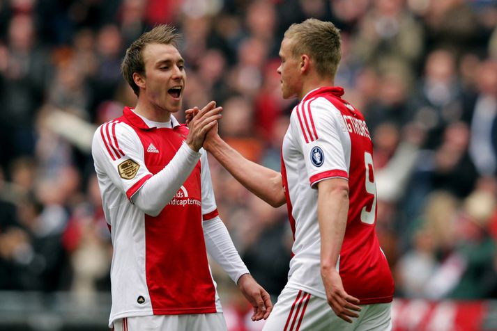 Christian Eriksen fagnar hér marki með Kolbeini Sigþórssyni.