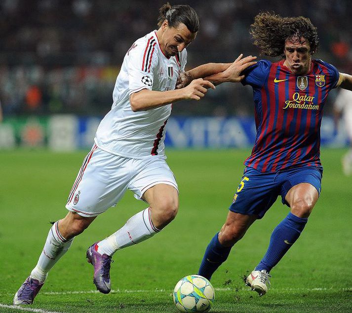 Carles Puyol og Zlatan Ibrahimovic eigast við í fyrri leik Barcelona og AC Milan.
