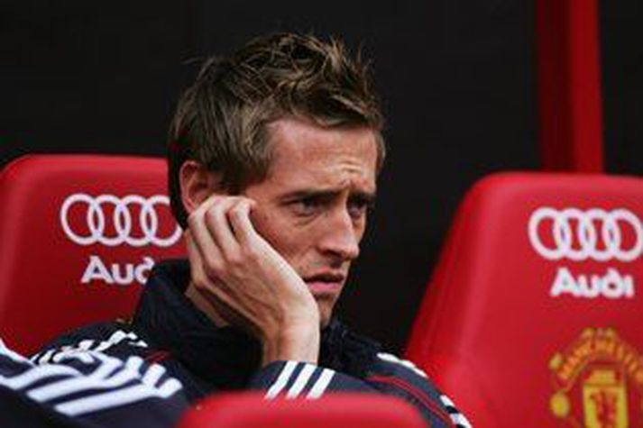 Crouch hefur mikið þurft að vera á varamannabekk Liverpool síðan félagið fékk Fernando Torres.