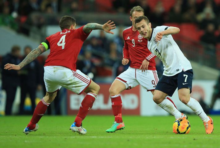 Agger og Wilshere í leiknum í vikunni.