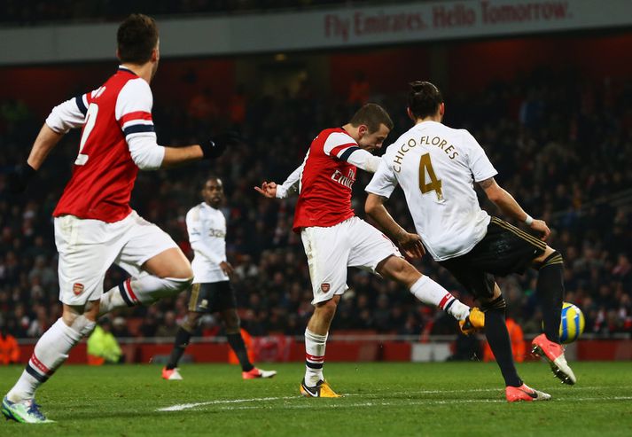 Jack Wilshere skorar hér sigurmarkið.