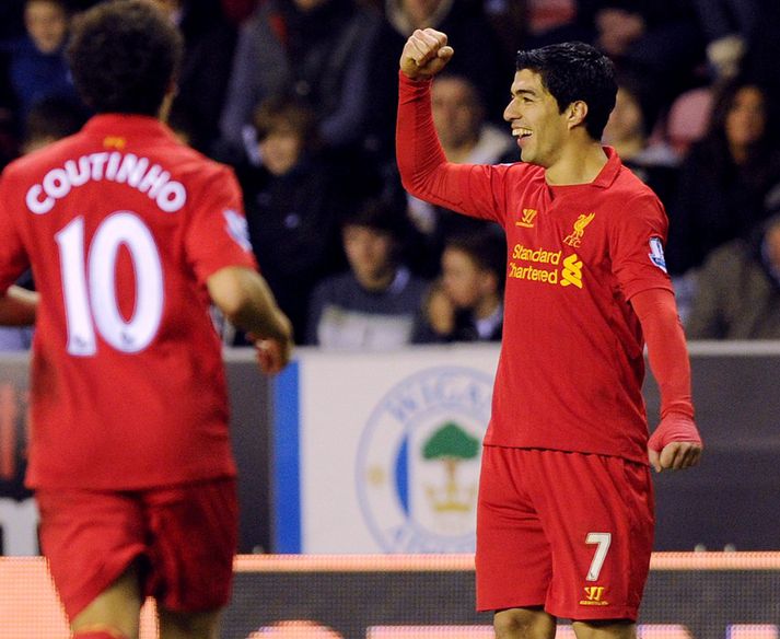 Suarez fagnar í dag.