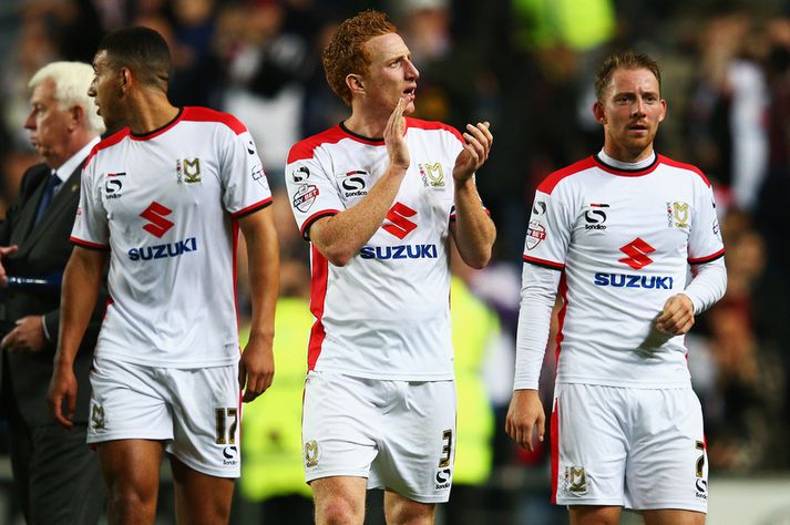 MK Dons-liðið kostar minna en Rooney fær á viku.